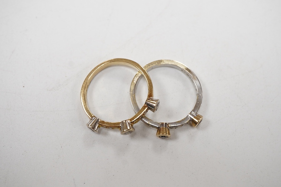 Two modern similar 14ct gold and diamond rings, one in yellow gold, with three collet set stones and six smaller stones, size P/Q, the other set in 9ct white gold, with two collet set stones and eleven smaller stones, si